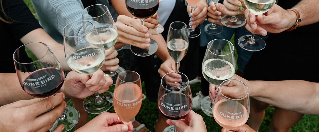 group cheers dune bird wine glasses