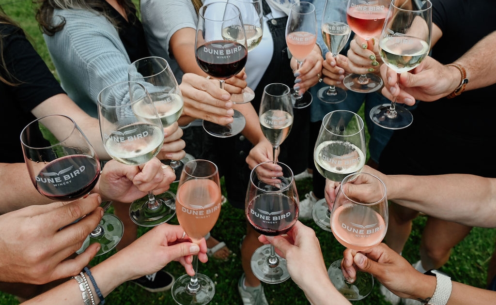 group cheers dune bird wine glasses